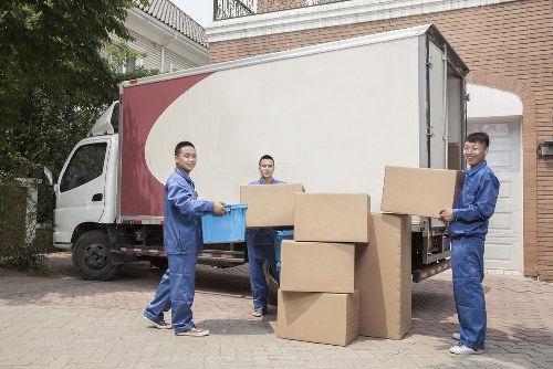 Specialist movers loading a grand piano carefully