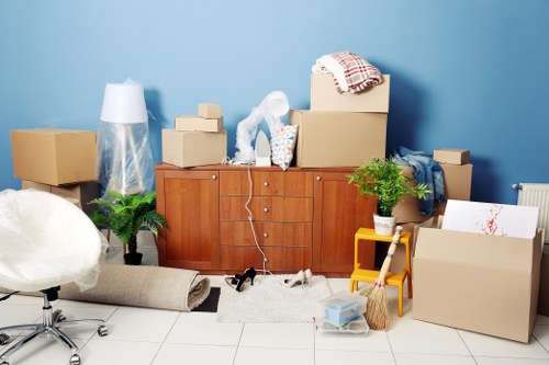Two movers handling furniture carefully during a removal job