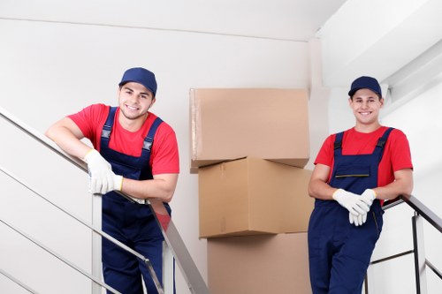 Professional movers handling office equipment during commercial relocation