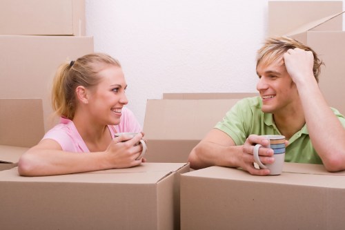 Professional office movers loading items in Queens Park