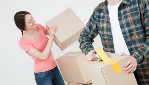 Workers using proper manual handling techniques