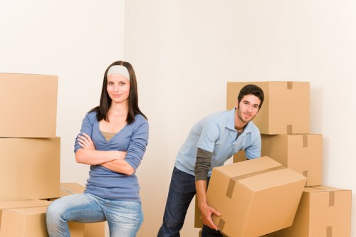 Queenspark moving team handling household furniture safely