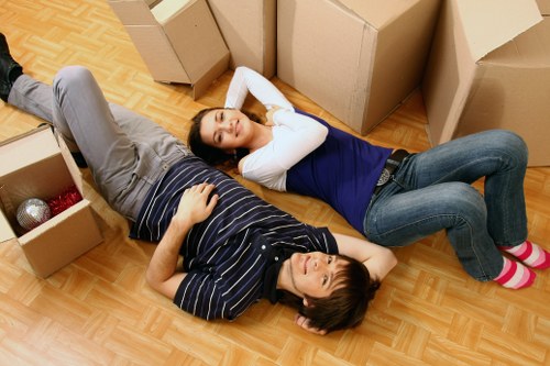 Team loading furniture safely into a van with care