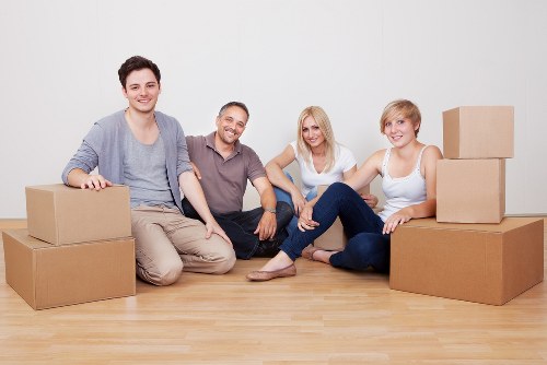 Loading furniture into a van near Queens Park for a local transport job
