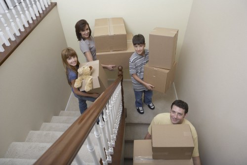 Unpacking and organizing boxes in a new Queenspark home
